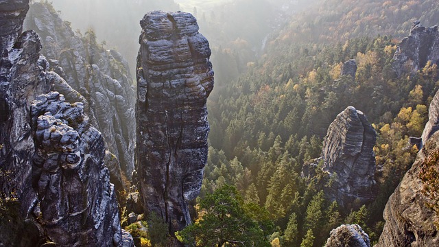 Mountain climber ascending a rock face.
